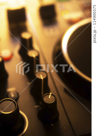Dj turntables in nightclub Dj turntables in nightclub 114900375