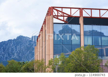 Modern Building with Mountain Reflection Modern Building with Mountain Reflection 114900743