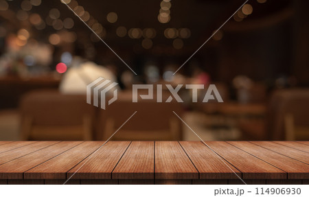 Empty wooden table top with lights bokeh on blur restaurant background Empty wooden table top with lights bokeh on blur restaurant background 114906930