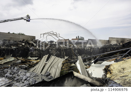 Firefighter putting out a fire in Zellik, Belgium 114906976