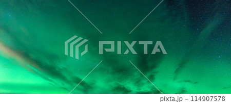 Aurora Borealis, Northern lights glowing with starry in the night sky 114907578