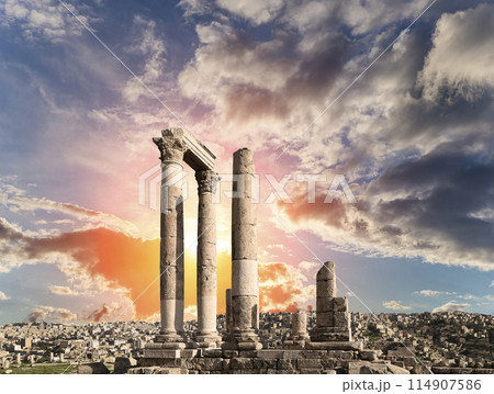 Amman city landmarks-- old roman Citadel Hill, Jordan. Against the background of a beautiful sky with clouds Amman city landmarks-- old roman Citadel Hill, Jordan. Against the background of a beautiful sky with clouds 114907586