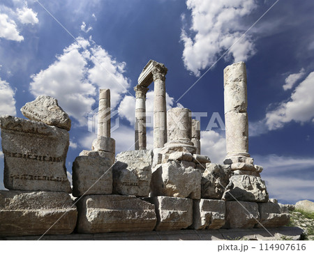 Amman city landmarks-- old roman Citadel Hill, Jordan. Against the background of a beautiful sky with clouds 114907616