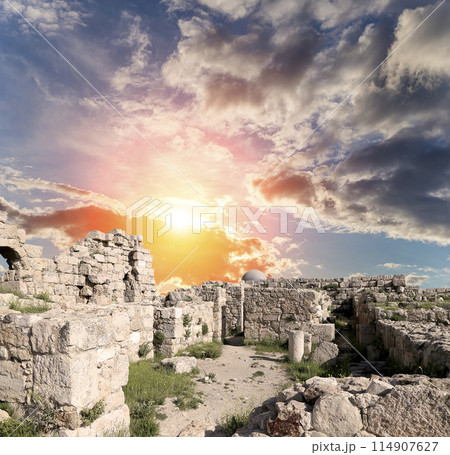 Amman city landmarks-- old roman Citadel Hill, Jordan. Against the background of a beautiful sky with clouds 114907627