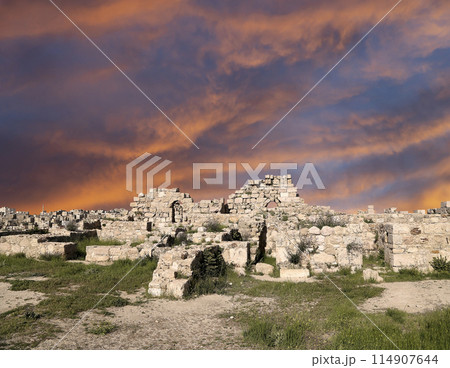 Amman city landmarks-- old roman Citadel Hill, Jordan. Against the background of a beautiful sky with clouds 114907644