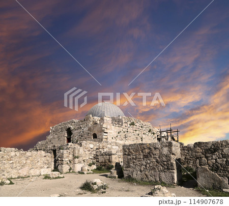 Amman city landmarks-- old roman Citadel Hill, Jordan. Against the background of a beautiful sky with clouds Amman city landmarks-- old roman Citadel Hill, Jordan. Against the background of a beautiful sky with clouds 114907678