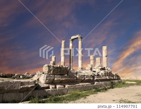 Amman city landmarks-- old roman Citadel Hill, Jordan. Against the background of a beautiful sky with clouds 114907701
