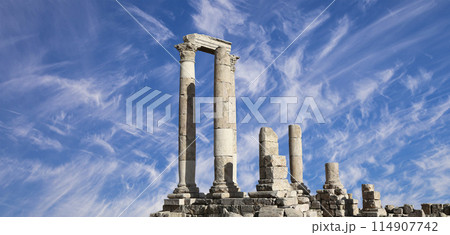 Amman city landmarks-- old roman Citadel Hill, Jordan. Against the background of a beautiful sky with clouds Amman city landmarks-- old roman Citadel Hill, Jordan. Against the background of a beautiful sky with clouds 114907742