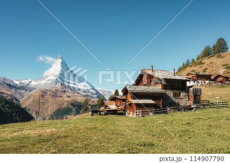Peaceful farming village on hill with matterhorn mountain in rural scene at Switzerland 114907790