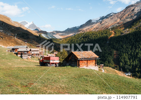 Farming village with wooden hut and truck among the Swiss Alps at Findeln, Switzerland Farming village with wooden hut and truck among the Swiss Alps at Findeln, Switzerland 114907791