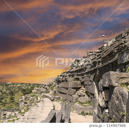 West Theatre of Umm Qais (Umm Qays)--is a town in northern Jordan near the site of the ancient town of Gadara, Jordan. Against the background of a beautiful sky with clouds 114907986