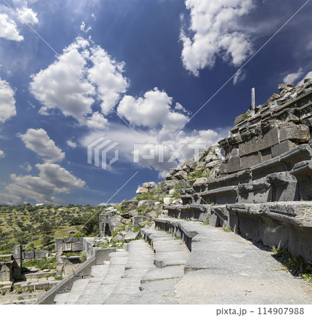West Theatre of Umm Qais (Umm Qays)--is a town in northern Jordan near the site of the ancient town of Gadara, Jordan. Against the background of a beautiful sky with clouds 114907988
