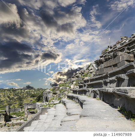 West Theatre of Umm Qais (Umm Qays)--is a town in northern Jordan near the site of the ancient town of Gadara, Jordan. Against the background of a beautiful sky with clouds 114907989