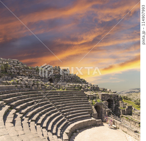 West Theatre of Umm Qais (Umm Qays)--is a town in northern Jordan near the site of the ancient town of Gadara, Jordan. Against the background of a beautiful sky with clouds West Theatre of Umm Qais (Umm Qays)--is a town in northern Jordan near the site of the ancient town of Gadara, Jordan. Against the background of a beautiful sky with clouds 114907993