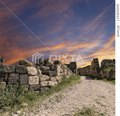 Roman ruins at Umm Qais (Umm Qays)--is a town in northern Jordan near the site of the ancient town of Gadara, Jordan. Against the background of a beautiful sky with clouds Roman ruins at Umm Qais (Umm Qays)--is a town in northern Jordan near the site of the ancient town of Gadara, Jordan. Against the background of a beautiful sky with clouds 114908040