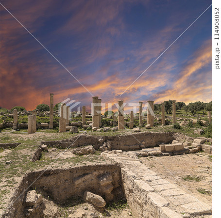Roman ruins at Umm Qais (Umm Qays)--is a town in northern Jordan near the site of the ancient town of Gadara, Jordan. Against the background of a beautiful sky with clouds 114908052