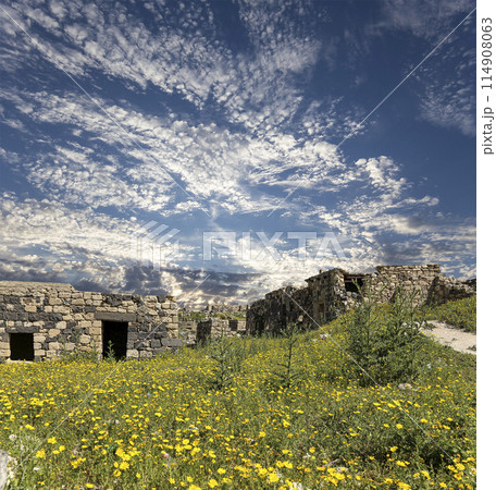 Roman ruins at Umm Qais (Umm Qays)--is a town in northern Jordan near the site of the ancient town of Gadara, Jordan. Against the background of a beautiful sky with clouds 114908063