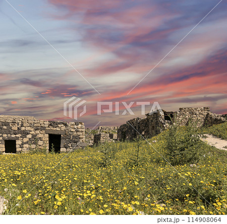 Roman ruins at Umm Qais (Umm Qays)--is a town in northern Jordan near the site of the ancient town of Gadara, Jordan. Against the background of a beautiful sky with clouds 114908064