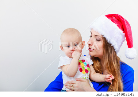Christmas woman with cute baby. 114908145