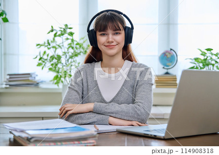 Portrait of teenage college student wearing headphones Portrait of teenage college student wearing headphones 114908318