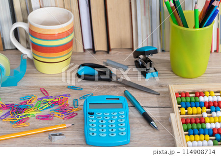 Office accessories necessary for learning. The paper clips are on the desk. School materials. Office accessories necessary for learning. The paper clips are on the desk. School materials. 114908714