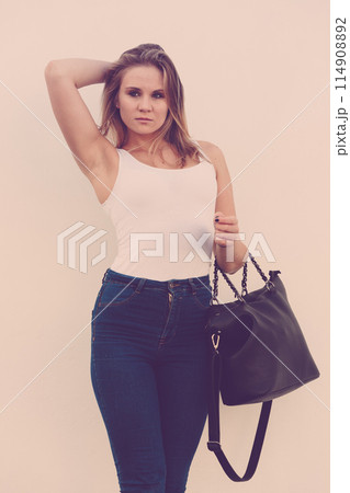 Trendy urban girl outdoors Trendy urban girl outdoors 114908892