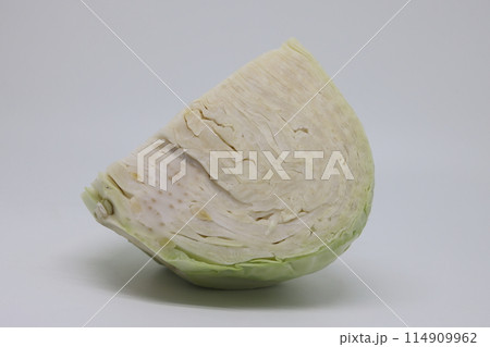 Sliced white cabbage quarter and chopped stack isolated on white background. 114909962
