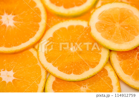 Sliced freshness orange fruit background. Round Pattern. 114912759