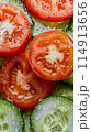 slices of cucumbers and tomatoes, vegetable texture 114913656