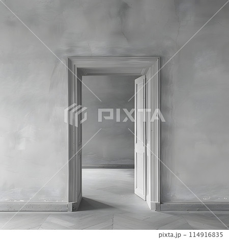 A monochrome photograph of a wooden door with glass panels in a grey room. The transparent material adds depth to the darkness of the empty space 114916835