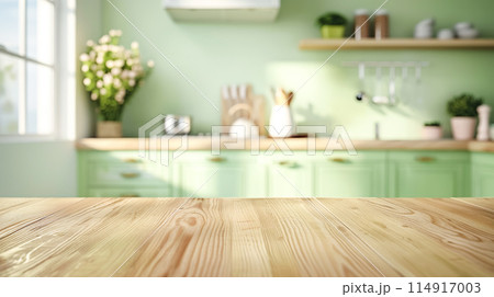 Wooden light empty countertop on the background of a modern light green kitchen, kitchen panel with accessories in the interior. Scene showcase template for promotional items, banner, copy space Wooden light empty countertop on the background of a modern light green kitchen, kitchen panel with accessories in the interior. Scene showcase template for promotional items, banner, copy space 114917003