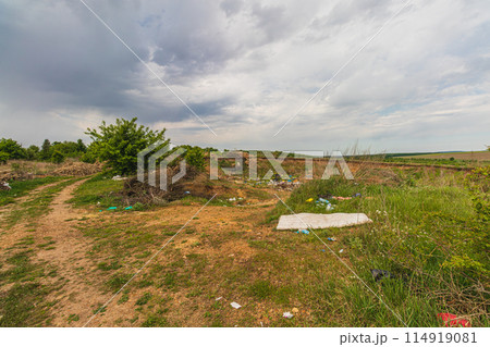 Pollution concept. Spontaneous uncontrolled landfill. Lytachi Ukraine 06.05.2024 114919081