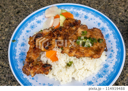 Vietnamese grilled pork chop and fried egg rice- Com Tam Vietnamese grilled pork chop and fried egg rice- Com Tam 114919488