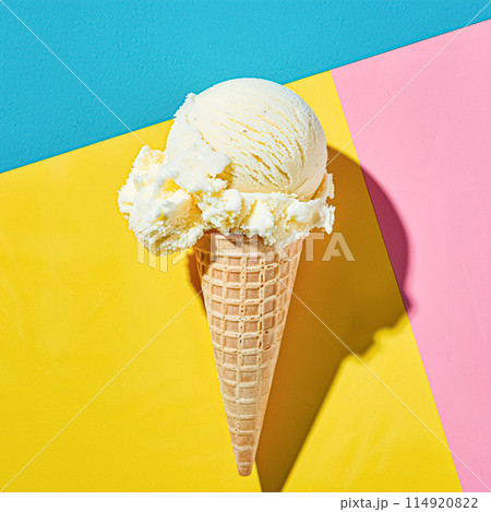 Scoops of ice cream in a waffle cone on a colorful background Scoops of ice cream in a waffle cone on a colorful background 114920822