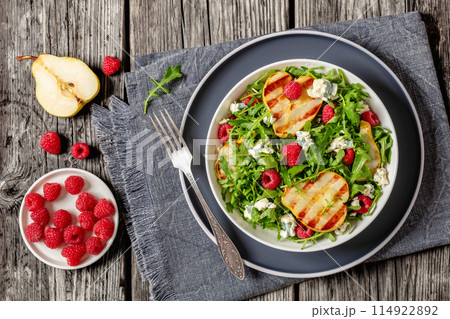 grilled pear salad with cheese, arugula, berries grilled pear salad with cheese, arugula, berries 114922892