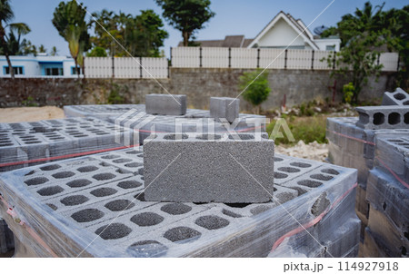 Concrete blocks with holes stacked on top of each other 114927918