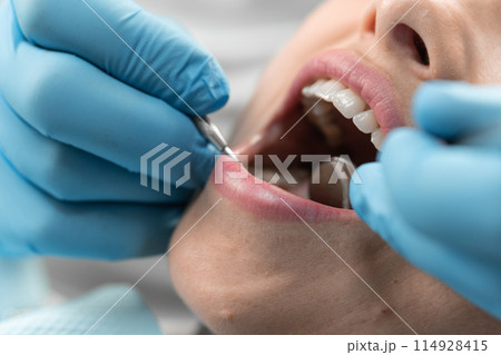The dentist conducts research and advises the patient on the best methods of treatment and dental care. Her professional approach guarantees the best results for patients. 114928415