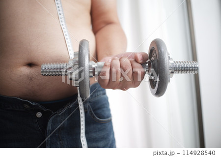 Fat men start exercising by lifting weights Fat men start exercising by lifting weights 114928540