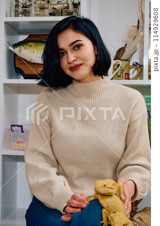 Beautiful Woman Posing with Her Two Adorable Bearded Dragon Pets Beautiful Woman Posing with Her Two Adorable Bearded Dragon Pets 114929608