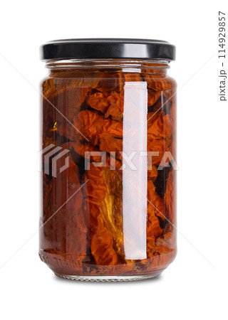 Sun-dried tomatoes in sunflower oil, antipasto in glass jar with screw cap. Whole tomatoes, air dried under the Italian sun, marinated and preserved in sunflower oil, vinegar, herbs, spices and salt. Sun-dried tomatoes in sunflower oil, antipasto in glass jar with screw cap. Whole tomatoes, air dried under the Italian sun, marinated and preserved in sunflower oil, vinegar, herbs, spices and salt. 114929857