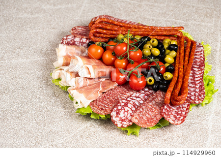 Beautiful serving of sausage sliced meat delicacies Beautiful serving of sausage sliced meat delicacies 114929960