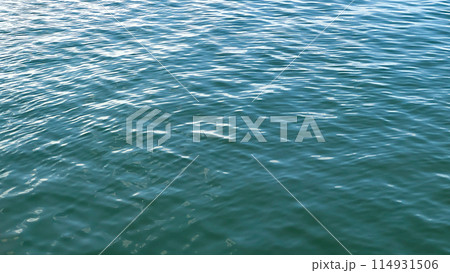 blue sea surface with foam and waves 114931506
