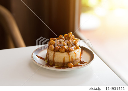 A decadent caramel cheesecake with a nutty macadamia topping. A decadent caramel cheesecake with a nutty macadamia topping. 114931521