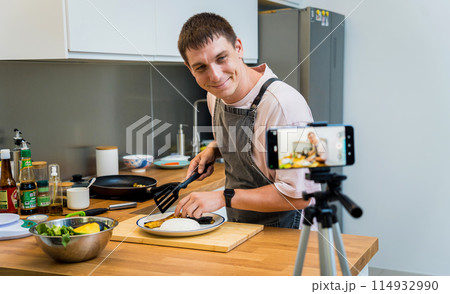 The chef is broadcasting live from workshop how to prepare a grilled eggplants with garlic The chef is broadcasting live from workshop how to prepare a grilled eggplants with garlic 114932990