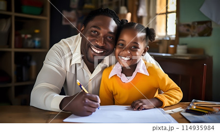 Father and daughter smiling while drawing together at home 114935984