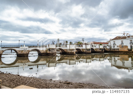 Roman bridge in Tavira, Algarve, Portugal. Ponte Romana bridge in Tavira town Roman bridge in Tavira, Algarve, Portugal. Ponte Romana bridge in Tavira town 114937135
