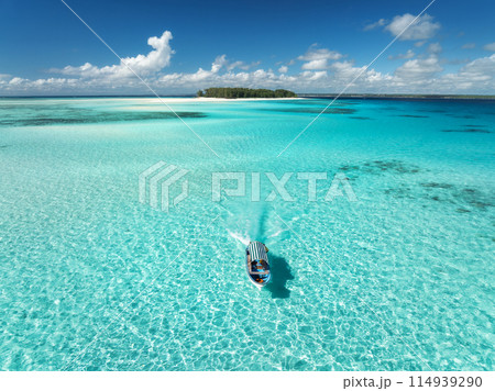 Aerial view of colorful boat, sandbank, blue sea on sunny day Aerial view of colorful boat, sandbank, blue sea on sunny day 114939290