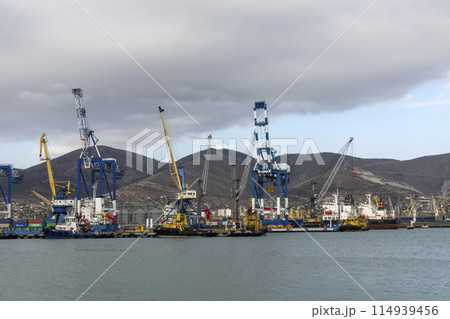 Novorossiysk, Russia 08.18.2023. Port cranes, Black Sea, port, Krasnodar Territory, Novorossiys Novorossiysk, Russia 08.18.2023. Port cranes, Black Sea, port, Krasnodar Territory, Novorossiys 114939456