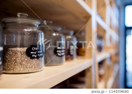 Food containers in zero waste shop filled with raw food. 114939680