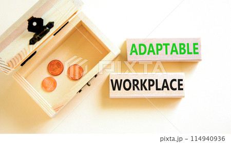Adaptable workplace symbol. Concept words Adaptable workplace on beautiful wooden block. Beautiful white paper background. Wooden chest with coins. Business Adaptable workplace concept. Copy space. 114940936